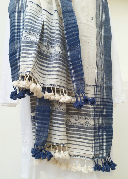 Blue and white striped scarf with tassels on a white background