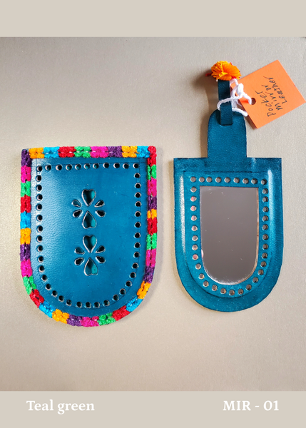 hand crafted bright teal green hand-cut leather pocket mirror with decorative perforations