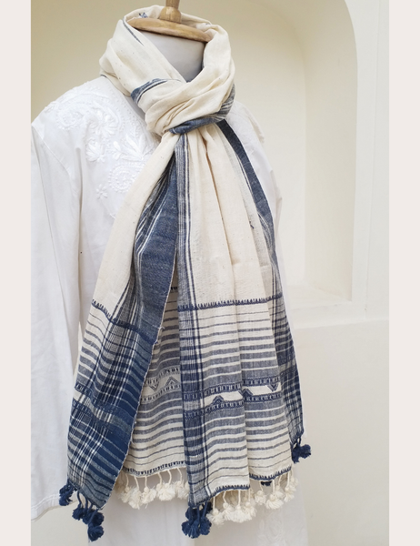 Blue and white patterned scarf on a mannequin against a plain background