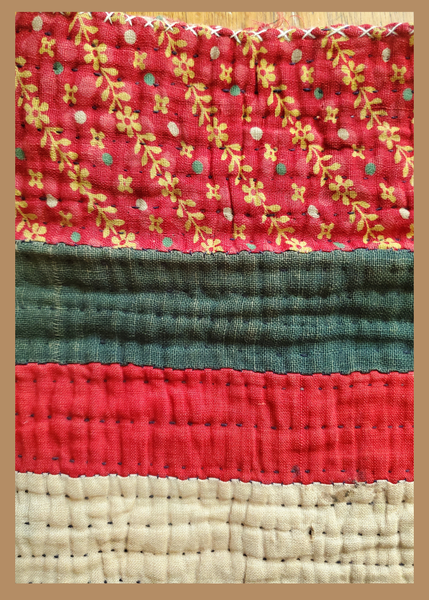 closeup of gudri hand quilting on traveler's bag