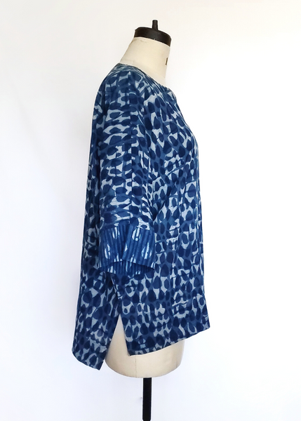 Mannequin with Liza Top. Round Neck with Tiny V cut. Side view shows the top is slightly shorter in front than the back.