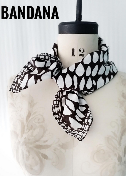 Butti print scarf tied on mannequin.