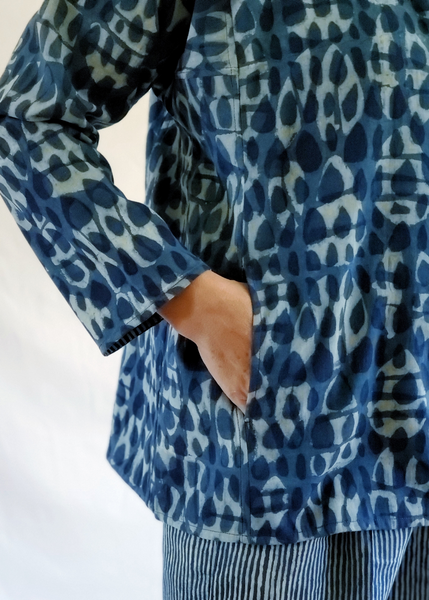 Close up of blouse, showing pockets sit at waistline.