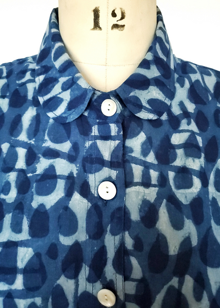 Mannequin with Elena Shirt in Indigo Basalt Print Button Up Top With Collar.