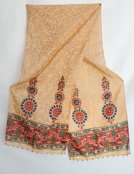 Long scarf that is red, blue and green details.