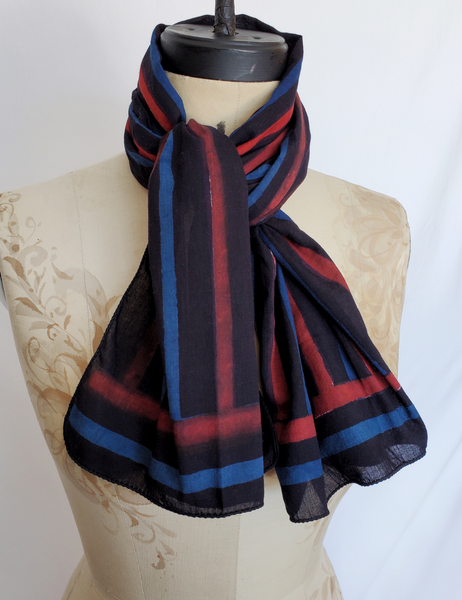 Blue, red and black striped hand block print scarf. The black stripe is the thickest and most prominent.