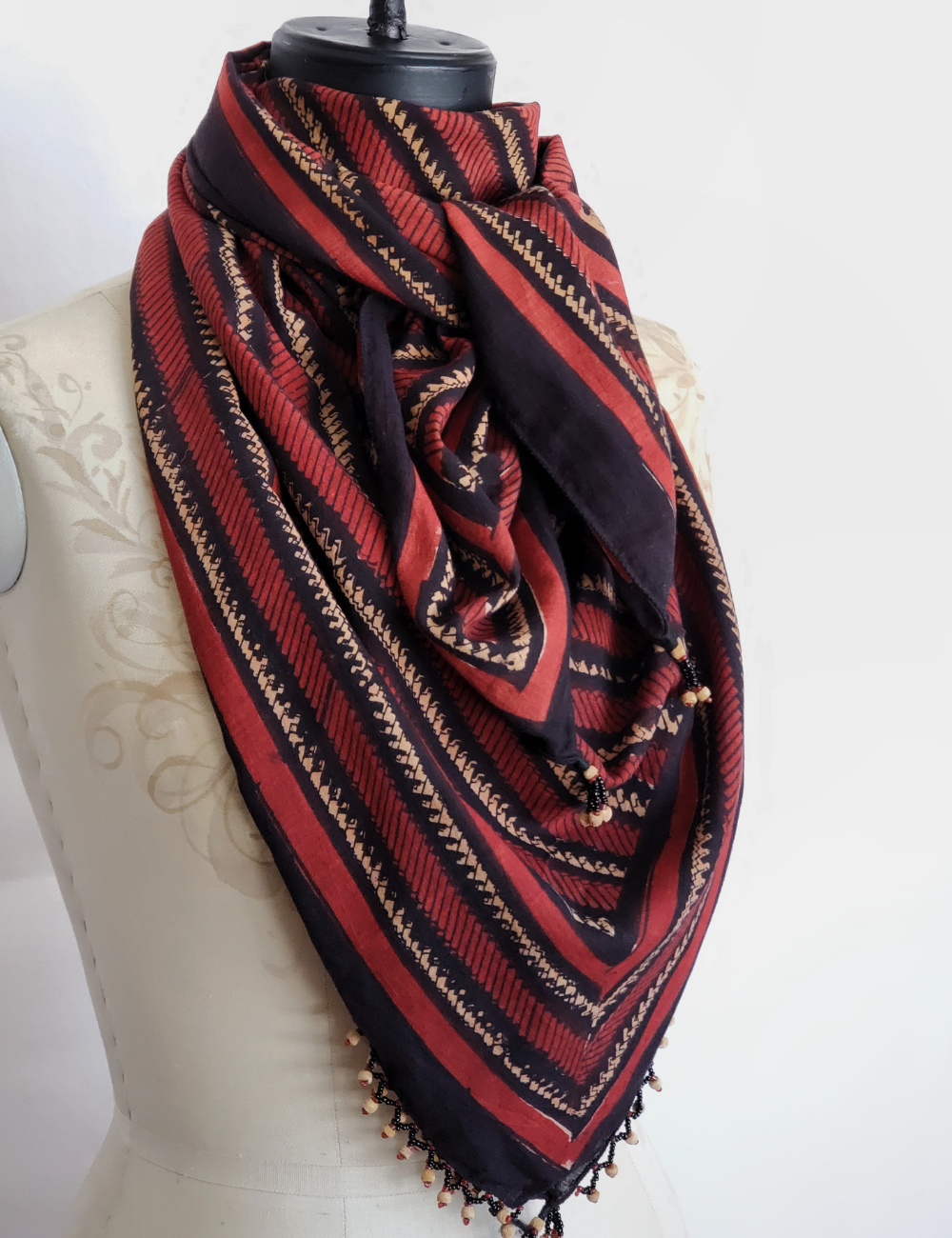 Long red and black borneo stripe scarf with wooden beads.