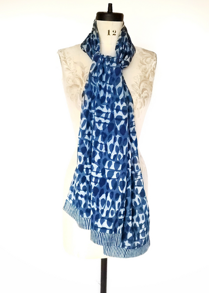 Indigo basalt print scarf with striped hems.