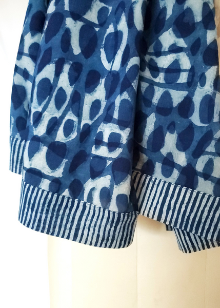 Indigo basalt print scarf with striped hems.