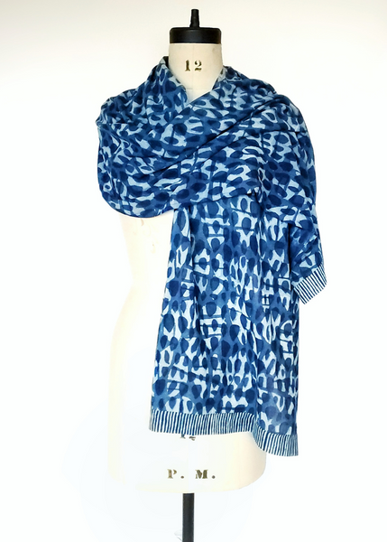 Indigo basalt print scarf with striped hems.