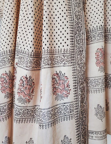 Long heirloom botanical scarf wrapped around mannequin.