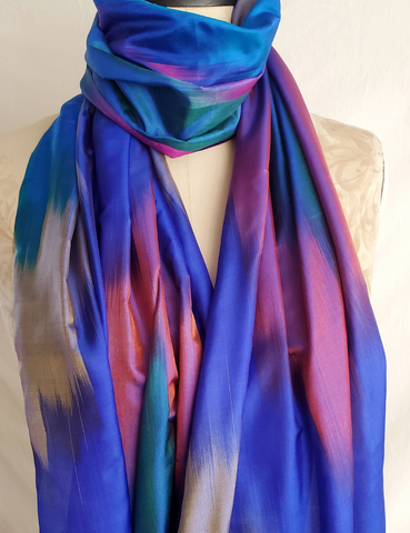 Rainbow hued scarf with tassles.
