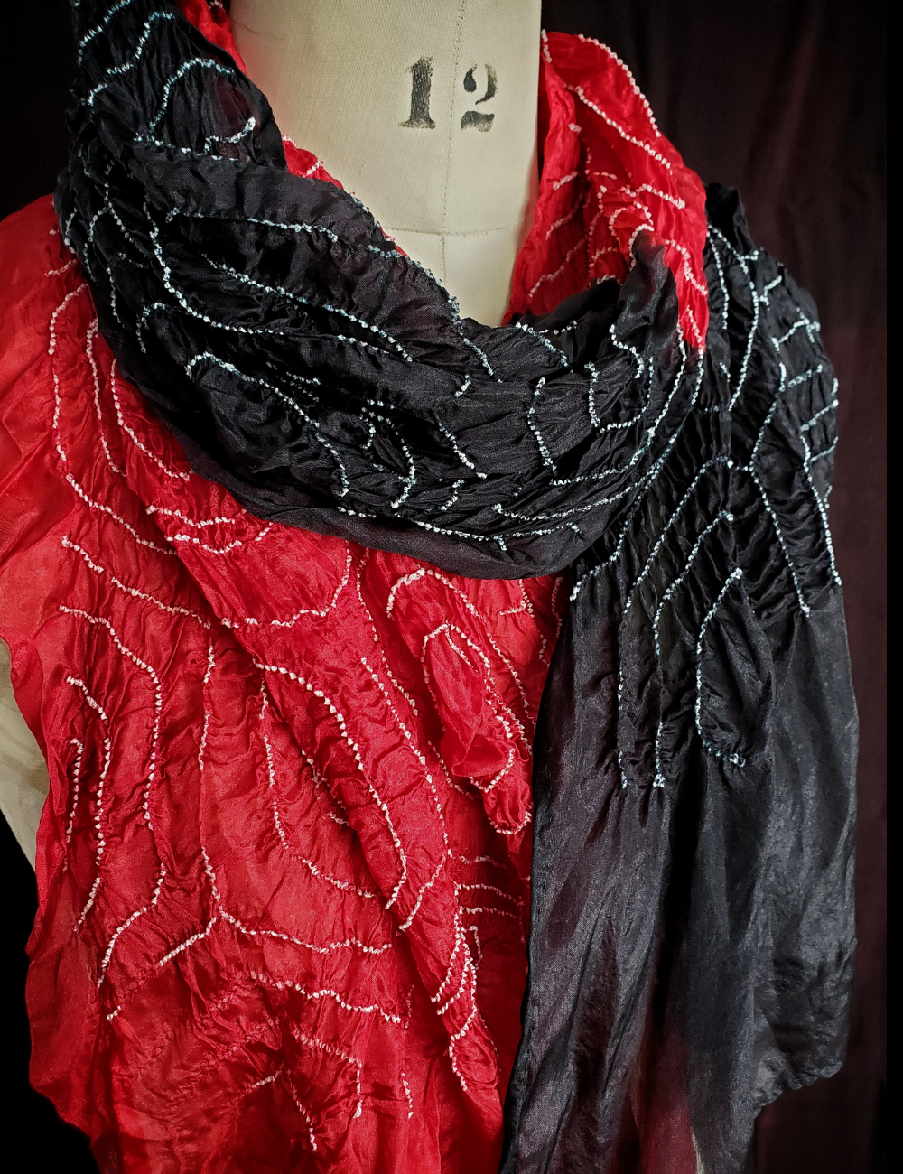 Crimson and black half and half scarf.