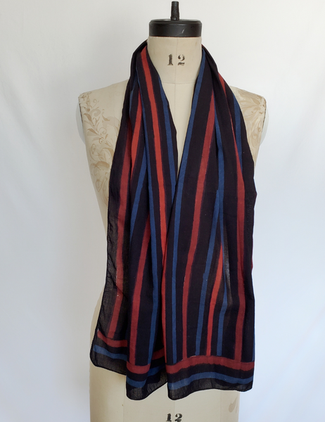 Blue, red and black striped hand block print scarf. The black stripe is the thickest and most prominent.